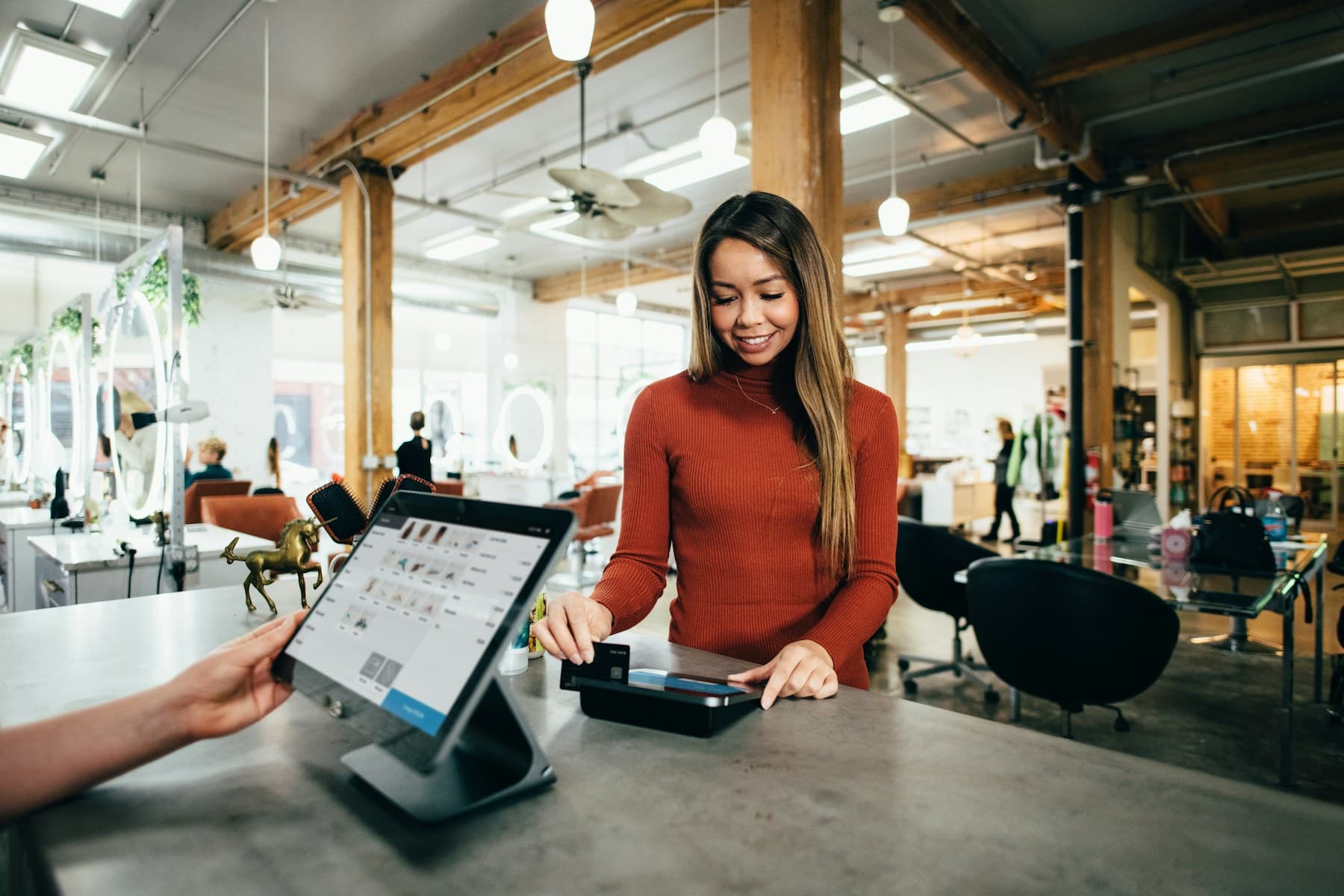 Shopper checking out at a retail point-of-sale counter